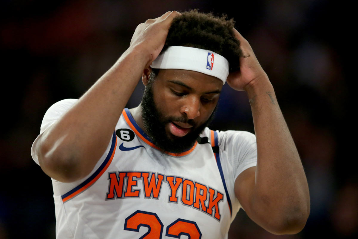Knicks center Mitchell Robinson puts his hands on his head during Game 1 against Heat